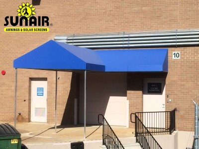 Blue V shaped canopy over entrance